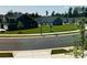 Street view of neighborhood with well-maintained lawns, townhomes, and green trees at 934 Prince Garrett Way, Denver, NC 28037