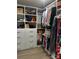 Spacious walk-in closet features custom shelving, drawers, and ample hanging space for organized storage solutions at 934 Prince Garrett Way, Denver, NC 28037