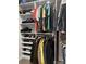 This walk-in closet features built-in shelving and hanging rods, providing ample storage for clothing and accessories at 934 Prince Garrett Way, Denver, NC 28037