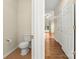 Neat and tidy half bathroom with toilet and tile floor at 9430 Duckhorn Dr, Charlotte, NC 28277