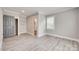 Gray bedroom with a modern gray wood-look flooring and a walk-in closet at 983 Willowbrook Ave, Rock Hill, SC 29730