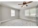 Empty bedroom featuring a ceiling fan, neutral paint, white trim, and light wood flooring at 983 Willowbrook Ave, Rock Hill, SC 29730