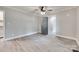 Clean, neutral bedroom with ceiling fan and hardwood-style flooring at 983 Willowbrook Ave, Rock Hill, SC 29730