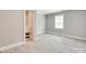 Neutral bedroom with a gray wood-look flooring and a walk-in bathroom at 983 Willowbrook Ave, Rock Hill, SC 29730