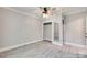 Empty bedroom featuring a ceiling fan, neutral paint, white trim, and light wood flooring at 983 Willowbrook Ave, Rock Hill, SC 29730