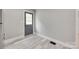 Small entryway featuring grey walls, white trim, and hardwood-style flooring at 983 Willowbrook Ave, Rock Hill, SC 29730
