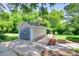Garage featuring a concrete parking space, a covered parking spot, and a shed in the background at 983 Willowbrook Ave, Rock Hill, SC 29730