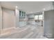 Bright kitchen featuring stainless steel appliances, shaker cabinets, and hardwood-style flooring at 983 Willowbrook Ave, Rock Hill, SC 29730