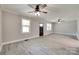 Spacious living area with ample natural light, ceiling fan, and modern flooring at 983 Willowbrook Ave, Rock Hill, SC 29730