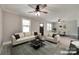Staged living room and dining room featuring modern furnishings and updated lighting at 983 Willowbrook Ave, Rock Hill, SC 29730