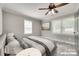Staged main bedroom with a ceiling fan, neutral paint, white trim, and light wood flooring at 983 Willowbrook Ave, Rock Hill, SC 29730