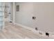 Room with gray walls, white trim and light wood flooring with visible electrical wiring at 983 Willowbrook Ave, Rock Hill, SC 29730