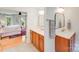 Bathroom showing double vanity and bedroom view with king bed at 10338 Hollybrook Dr, Charlotte, NC 28277