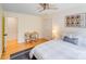 Spacious bedroom featuring a ceiling fan, a large window, closet, and wooden floors at 10338 Hollybrook Dr, Charlotte, NC 28277