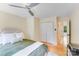 Comfortable bedroom with a ceiling fan, closet and wooden floors at 10338 Hollybrook Dr, Charlotte, NC 28277