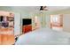 Bedroom with hardwood floors, walk-in closet, ceiling fan and ensuite bath at 10338 Hollybrook Dr, Charlotte, NC 28277