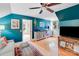 Upstairs bonus room with blue accent wall and hardwood floors at 10338 Hollybrook Dr, Charlotte, NC 28277