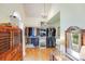 Large closet with hardwood floors, chandelier, window and shelving units at 10338 Hollybrook Dr, Charlotte, NC 28277