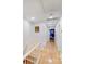 Upstairs hallway with wood floors, wainscoting, and access to multiple rooms at 10338 Hollybrook Dr, Charlotte, NC 28277