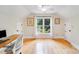 Bright home office featuring hardwood floors, a large window, and ample space at 10338 Hollybrook Dr, Charlotte, NC 28277