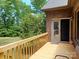 Cozy outdoor deck featuring wood railings and an adjacent brick exterior wall at 1061 Nw 14Th Avenue Nw Dr, Hickory, NC 28601