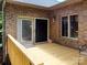 Cozy outdoor deck featuring wood railings and an adjacent brick exterior wall at 1061 Nw 14Th Avenue Nw Dr, Hickory, NC 28601