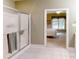 Bathroom featuring tiled floor and a glass-enclosed shower leading to a bedroom at 1061 Nw 14Th Avenue Nw Dr, Hickory, NC 28601