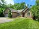 Eye-catching brick home features an attached garage and a well-maintained front lawn at 1061 Nw 14Th Avenue Nw Dr, Hickory, NC 28601