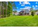 Expansive backyard featuring a well-maintained lawn and a spacious deck, perfect for outdoor enjoyment at 107 Blue Ridge Trl, Mooresville, NC 28117
