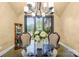 Formal dining room featuring a modern chandelier, neutral walls and floors, and a dining set for elegant meals at 107 Blue Ridge Trl, Mooresville, NC 28117