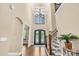 Grand foyer with high ceilings, a decorative chandelier, elegant staircase, and hardwood floors at 107 Blue Ridge Trl, Mooresville, NC 28117