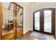 Elegant foyer featuring hardwood floors, a decorative door, and a nearby office space at 107 Blue Ridge Trl, Mooresville, NC 28117