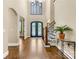 Impressive foyer with a chandelier, hardwood floors, a staircase, and abundant natural light at 107 Blue Ridge Trl, Mooresville, NC 28117
