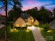 Elegant exterior view of the home at twilight, showcasing manicured landscaping and inviting curb appeal at 107 Blue Ridge Trl, Mooresville, NC 28117