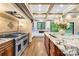 Gourmet kitchen with a large island, premium appliances, and a seamless connection to outdoor spaces at 107 Blue Ridge Trl, Mooresville, NC 28117