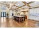 Open concept kitchen with a large island, wooden beams, and stainless steel appliances at 107 Blue Ridge Trl, Mooresville, NC 28117