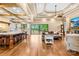 Open-concept layout with seamless transition from the kitchen island to the living room, and outdoor views at 107 Blue Ridge Trl, Mooresville, NC 28117