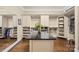 Spacious walk-in closet with custom shelving, drawers, and ample storage space at 107 Blue Ridge Trl, Mooresville, NC 28117