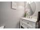 Close-up of bathroom vanity, mirror and flowers at 108 N Arcadian Way, Mooresville, NC 28117