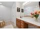 Elegant bathroom features a wooden vanity with large mirror and bright lighting at 108 N Arcadian Way, Mooresville, NC 28117