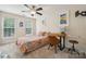 Comfortable bedroom with natural light features desk with a computer and ceiling fan at 108 N Arcadian Way, Mooresville, NC 28117
