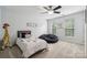 Cozy bedroom features a twin bed, a beanbag chair and lots of natural light at 108 N Arcadian Way, Mooresville, NC 28117