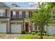 Charming brick townhome with a well-manicured lawn, attached garage, and a lovely front entrance at 108 N Arcadian Way, Mooresville, NC 28117
