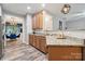 Kitchen featuring wood cabinets, granite countertops, and view of the dining room at 108 N Arcadian Way, Mooresville, NC 28117