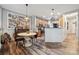 A cozy kitchen nook with wood floors and stainless steel appliances leads into the main living area at 108 N Arcadian Way, Mooresville, NC 28117