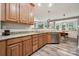 Open kitchen featuring wood cabinets, granite countertops, and stainless steel appliances at 108 N Arcadian Way, Mooresville, NC 28117
