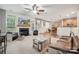 An expansive living room with a fireplace flows into the kitchen and dining nook at 108 N Arcadian Way, Mooresville, NC 28117