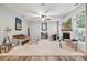 Spacious living room featuring a decorative ceiling fan, fireplace, and comfortable seating at 108 N Arcadian Way, Mooresville, NC 28117