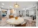 Bright, open living space seamlessly connects the kitchen and living room with stylish decor at 108 N Arcadian Way, Mooresville, NC 28117