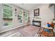 Bright sun room with large windows, patterned rug, and natural light at 108 N Arcadian Way, Mooresville, NC 28117